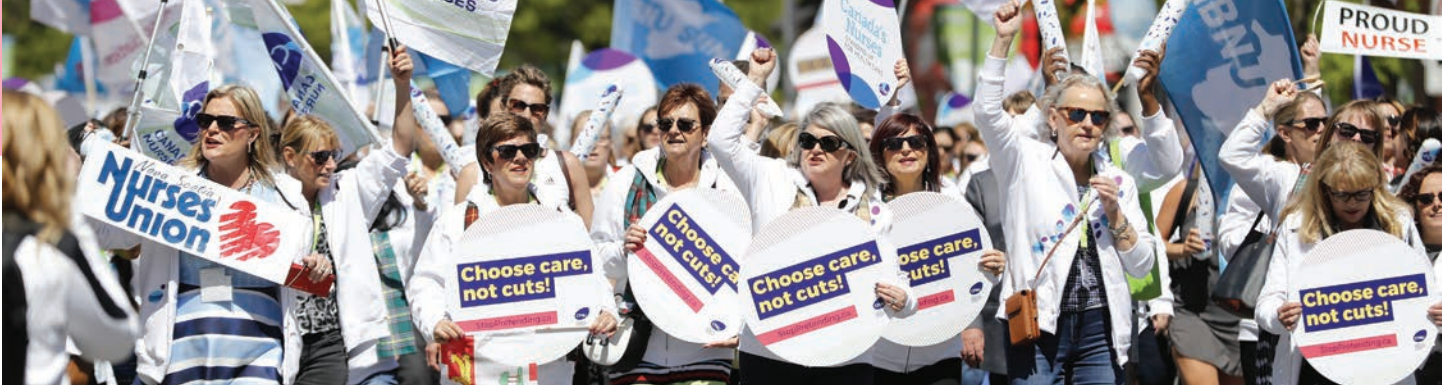 Nurses and supporters carrying Choose care, not cuts signs